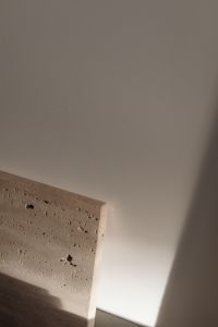 Kaboompics - Beige Wall with Porous Stone Slab in Sunlight