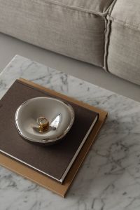 Kaboompics - Marble Coffee Table Detail with Design Book beside Beige Sofa