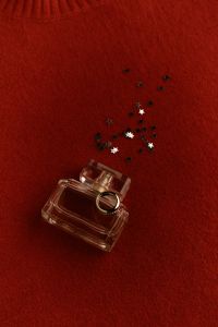 Kaboompics - Black Gift Box with Burgundy Velvet Bow on Red Background