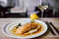 Kaboompics - Bourbon Glazed Salmon Plate with Wine Glass and Lemon in Soft Focus