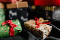 Kaboompics - Christmas Gift Boxes with a Joy Pillow in the Background