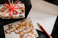 Kaboompics - Wrapped Christmas Gift with Card, Envelope and Writing Pen