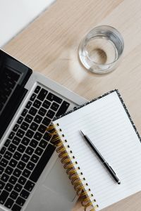 Kaboompics - Overhead Laptop, Notebook, Pen and Glass of Water on Desk