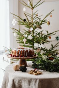 Kaboompics - Festive Christmas Table with Bundt Cake and Christmas Tree