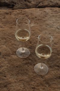 Kaboompics - Close-Up of Two Wine Glasses on Rough Coastal Rock