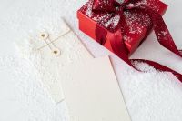 Kaboompics - Red Christmas Present and Blank Greeting Card for Seasonal Branding Mockups