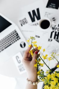 Kaboompics - Yellow flowers in vase and female hand