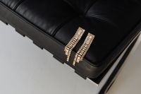 Kaboompics - Long Gold Earrings with Crystals Styled on a Lounge Chair