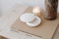 Kaboompics - Candle, White Dish and Dried Vase on Travertine Table