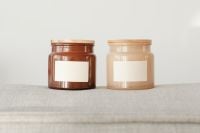 Kaboompics - Amber and Cream Candle Jar Mockups with Blank Labels
