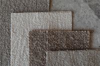Kaboompics - Layered Neutral Bouclé Upholstery Fabric Samples with Brown Center