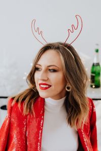 Kaboompics - Red Blazer New Year Portrait with Champagne Bottle in Background