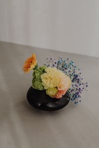 Kaboompics - Colorful Floral Arrangement with Orange Flower and Blue Fillers