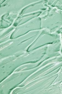 Kaboompics - Skincare Aesthetic Transparent Gel Macro Texture Pattern on Green Background