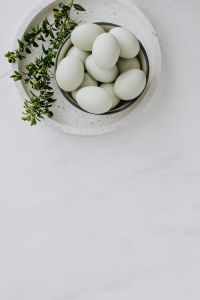 Kaboompics - Easter flat lay with green eggs on a white marble