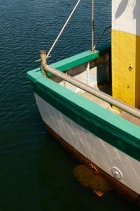 Kaboompics - Fishing Boat Floating in Calm Harbor Water