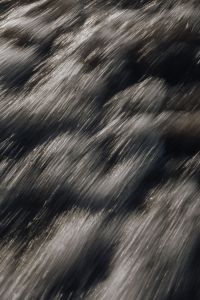 Kaboompics - Silver Current Streaks Across Black Water, Motion Blur Texture