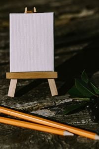 Small flowers, pencils and other things on wood