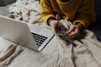 Kaboompics - Overhead Remote Work from Bed with Open Laptop and Smartphone