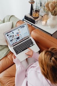 Kaboompics - Faceless Overhead View of Woman Using Laptop on Sofa