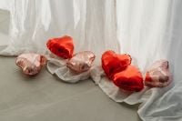 Kaboompics - Red and Rose Gold Heart Balloons on Flowing White Curtains