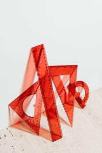 Kaboompics - Red Translucent Protractor, Set Squares and Rulers for Geometry Lessons and Math Study