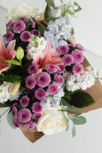 Kaboompics - Mixed Pastel Flower Bouquet Wrapped in Kraft Paper