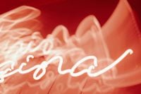 Kaboompics - Blurred Red Neon Lettering with Glowing Light Trails
