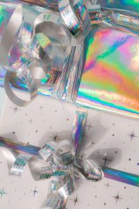 Kaboompics - Holographic Gift Wrap and Star Print Boxes Close Up
