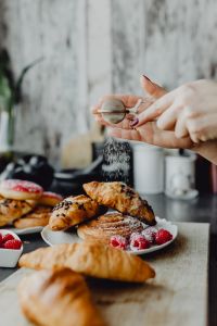 Kaboompics - Home Baking Scene with Croissants and Powdered Sugar