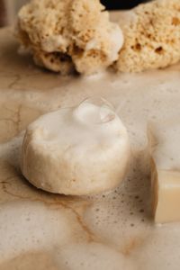 Kaboompics - White Round Soap Bar and Sea Sponge with Bubble
