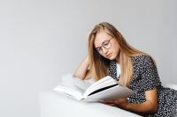 Kaboompics - Student Reading Open Book with Copy Space