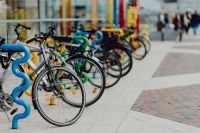 Kaboompics - Close View of Blue Bicycle Rack and Parked Bikes beside Manufaktura Plaza in Łódź
