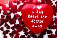 Kaboompics - Red Heart-Shaped Candy with Love Message and Confetti