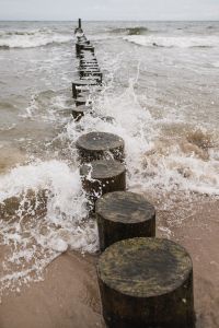 Ocean Wave Backgrounds with Coastal Groynes and Seashore Textures