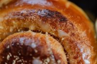 Kaboompics - Sugar-Dusted Cinnamon Roll Texture and Icing for Dessert Background Design