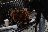 Kaboompics - Autumn Bouquet and Takeaway Coffee on a Black Metal Bench