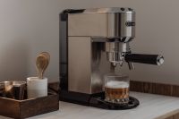 Kaboompics - Stainless Steel Espresso Machine with Layered Coffee