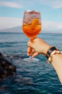 Kaboompics - Aperol Spritz with Lemon Slice and Island Sea Horizon