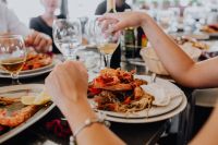 Kaboompics - Friends Sharing a Seafood Dinner with Wine