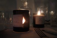 Kaboompics - Amber Candles and Glassware in Low Light