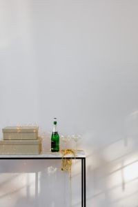 Kaboompics - Champagne Bottle and Glasses Beside Wrapped Gifts