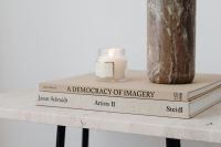 Kaboompics - Minimal Candle and Textured Vase on Art Books