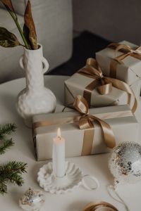 Kaboompics - Elegant Wrapped Gifts with Candles and Christmas Decor