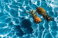 Kaboompics - Pineapple in a swimming pool