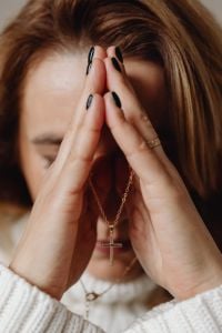 Kaboompics - Woman Resting with Closed Eyes and a Cross Necklace