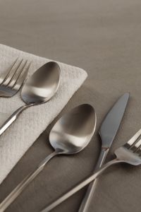 Kaboompics - Minimal Silverware Flat Lay with Napkin and Open Background Space