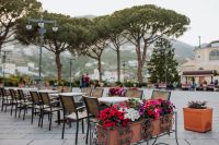 Kaboompics - Ravello Outdoor Cafe Tables beneath Pine Trees and Valley Views