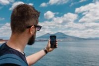 Kaboompics - Man Photographing Mount Vesuvius With a Smartphone in Naples