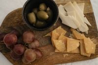 Kaboompics - Rustic Cheese Board with Grapes, Olives and Cheese